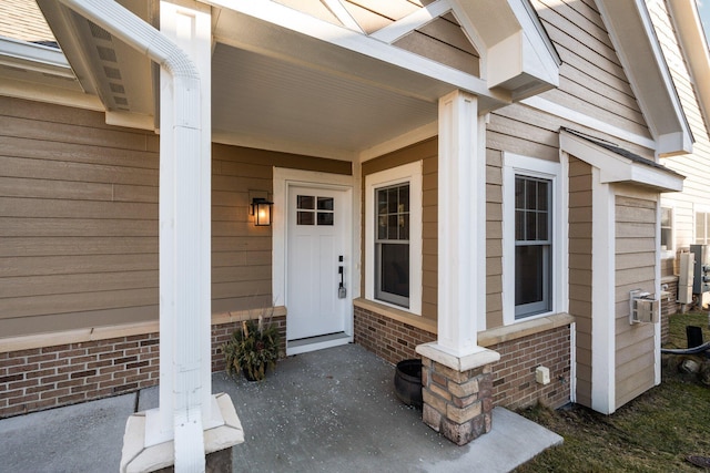 entrance to property with brick siding