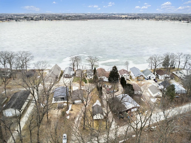 drone / aerial view with a residential view and a water view