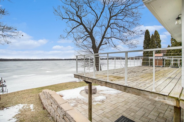 wooden deck with a water view