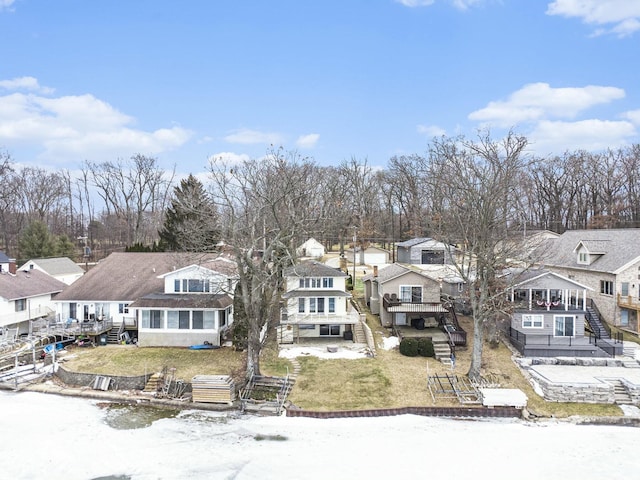 snowy aerial view featuring a residential view