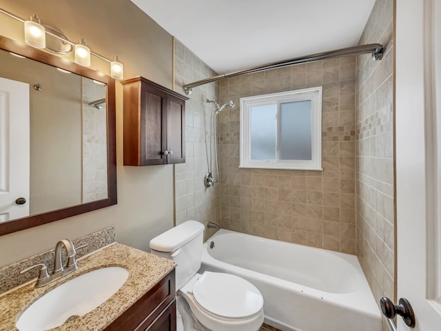 full bathroom featuring bathtub / shower combination, vanity, and toilet