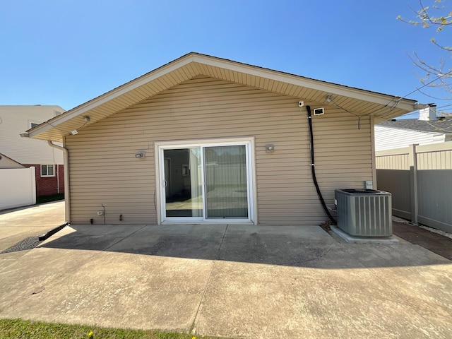 15455 Mulberry St, Southgate, MI 48195 - back of house featuring fence, central AC unit, and a patio area