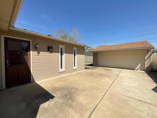 15455 Mulberry St, Southgate, MI 48195 - exterior space featuring an outbuilding, a detached garage, and a shingled roof