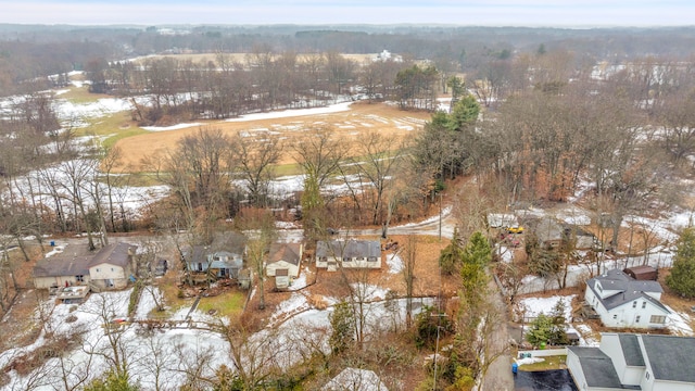 snowy aerial view featuring a residential view