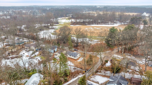 snowy aerial view with a forest view