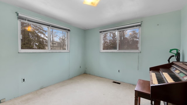 interior space featuring multiple windows and visible vents