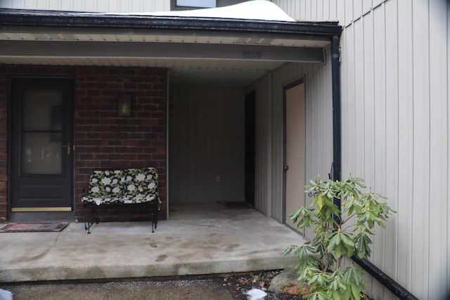 entrance to property with brick siding