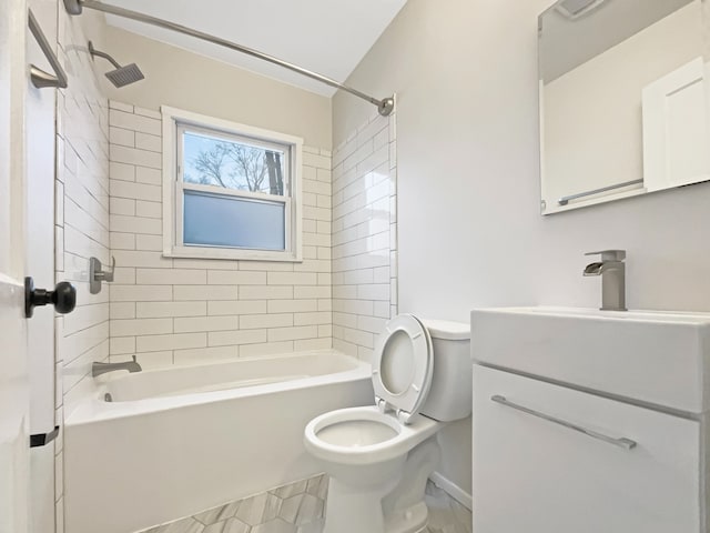 bathroom featuring toilet,  shower combination, and vanity