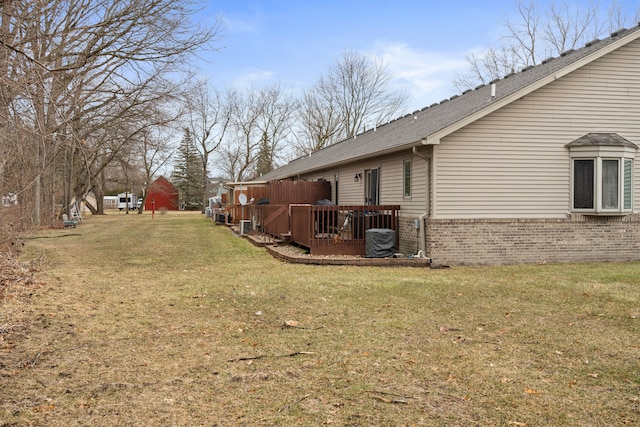 view of yard with a wooden deck