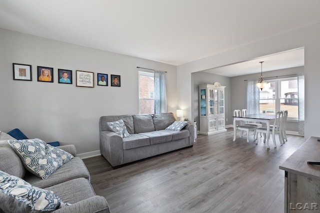 living room featuring wood finished floors and baseboards