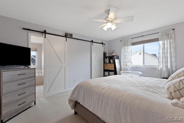 bedroom with a ceiling fan, light colored carpet, visible vents, and a barn door