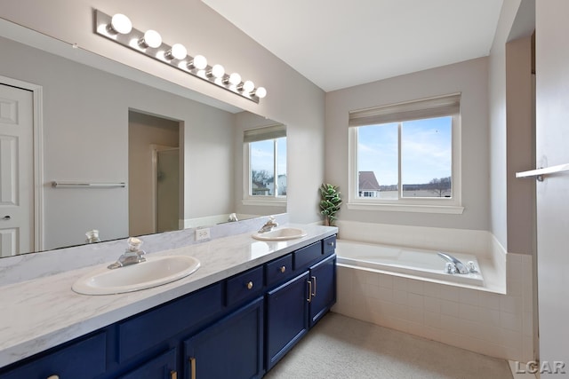 full bathroom with double vanity, a shower with shower door, a sink, and a bath