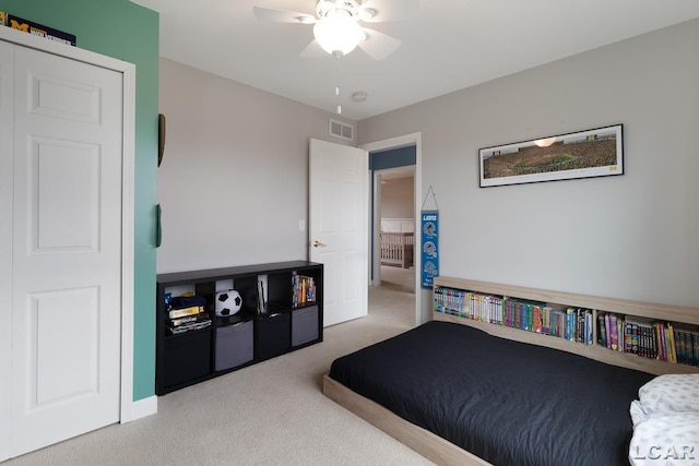 bedroom with a ceiling fan, visible vents, and carpet flooring