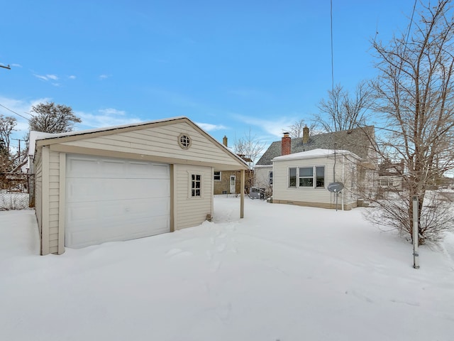 exterior space with a detached garage