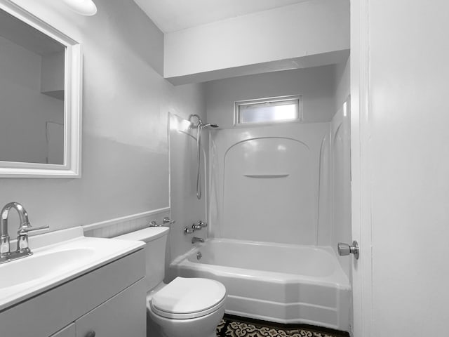 full bath featuring a wainscoted wall, shower / bathing tub combination, vanity, and toilet