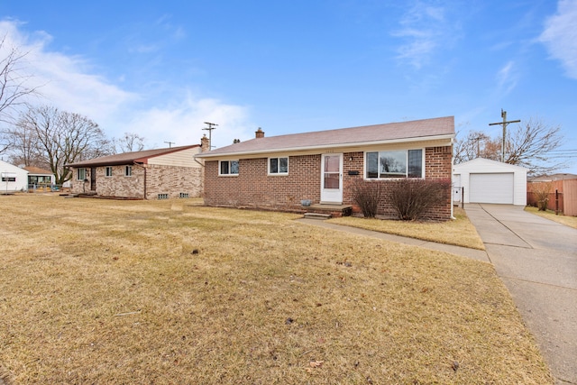 ranch-style house with an outbuilding, brick siding, entry steps, a front yard, and driveway