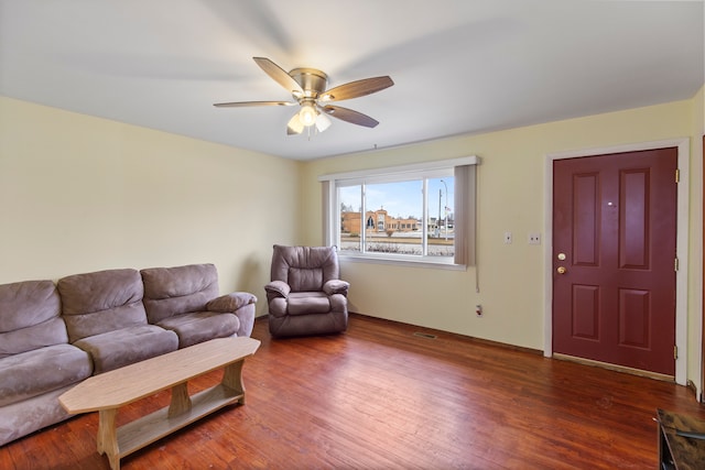 living room featuring ceiling fan and wood finished floors