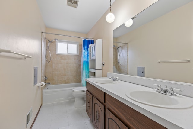 bathroom with a sink, visible vents, and shower / tub combo with curtain