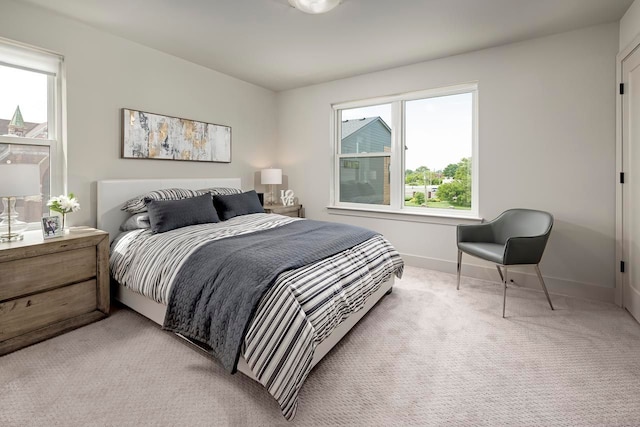 3628 Trumbull St Unit 11, Detroit, MI 48208 - bedroom with light carpet and baseboards
