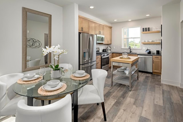 3628 Trumbull St Unit 11, Detroit, MI 48208 - kitchen with appliances with stainless steel finishes, dark wood-type flooring, tasteful backsplash, light brown cabinetry, and a sink