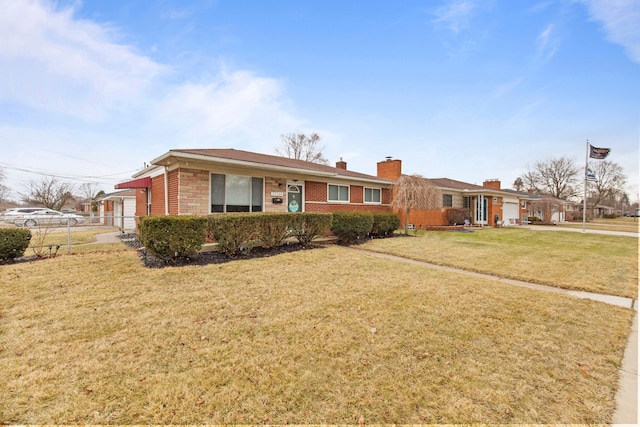 ranch-style house featuring a front lawn, a chimney, fence, and brick siding