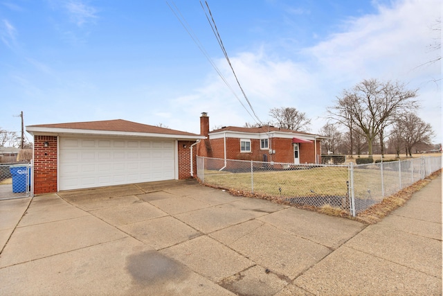 ranch-style house with a front lawn, a fenced front yard, a detached garage, and brick siding