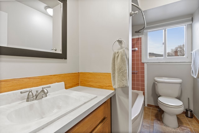 bathroom with shower / washtub combination, vanity, toilet, and tile patterned floors