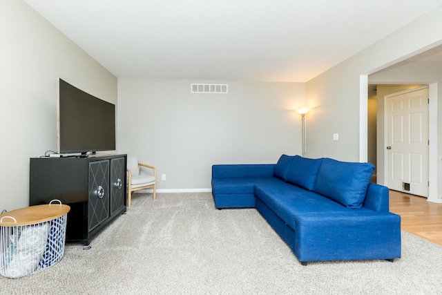 living room featuring visible vents and baseboards