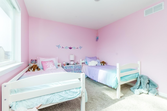 bedroom with carpet and visible vents