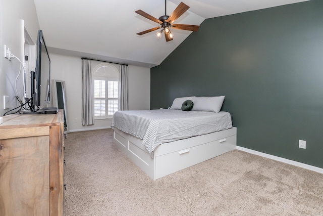 carpeted bedroom with vaulted ceiling and baseboards