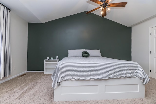 bedroom with visible vents, baseboards, a ceiling fan, lofted ceiling, and carpet