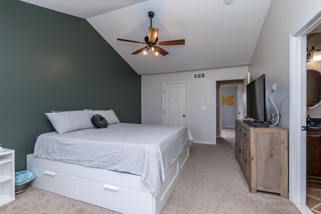 bedroom with lofted ceiling, ceiling fan, light colored carpet, visible vents, and baseboards