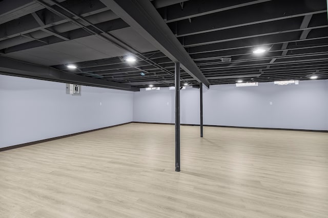 finished basement with wood finished floors and baseboards