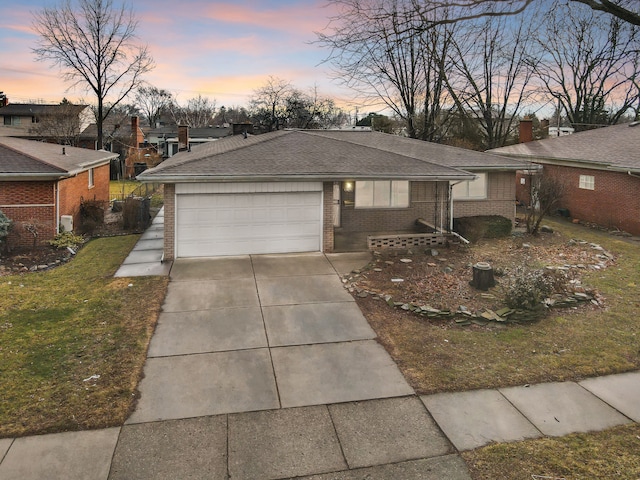 single story home featuring a garage, driveway, brick siding, and a shingled roof