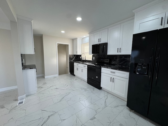 kitchen with decorative backsplash, marble finish floor, a sink, and black appliances