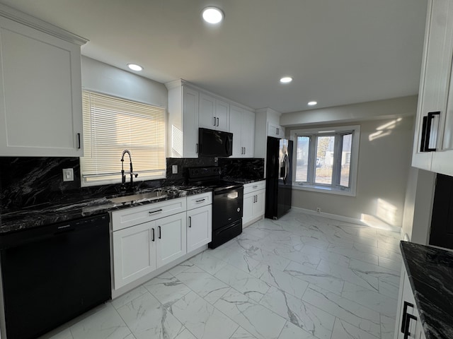 kitchen with black appliances, marble finish floor, backsplash, and a sink