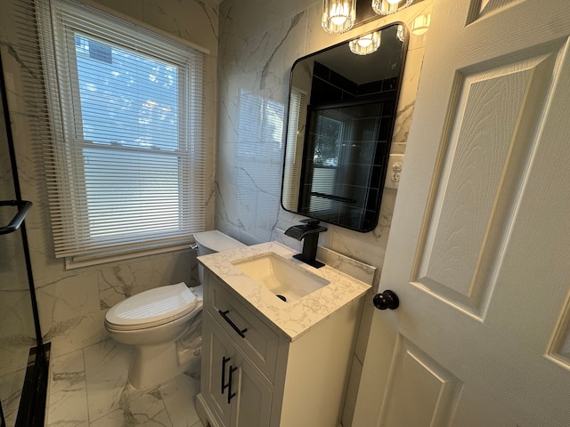 bathroom featuring tile walls, marble finish floor, vanity, and toilet