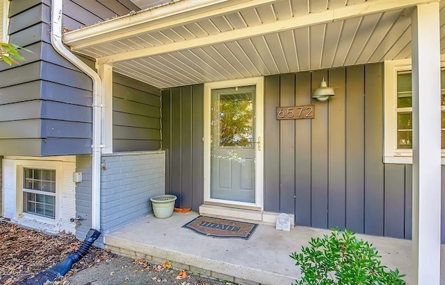 property entrance with brick siding