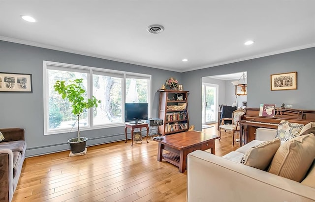 living area featuring ornamental molding, light wood-type flooring, visible vents, and recessed lighting