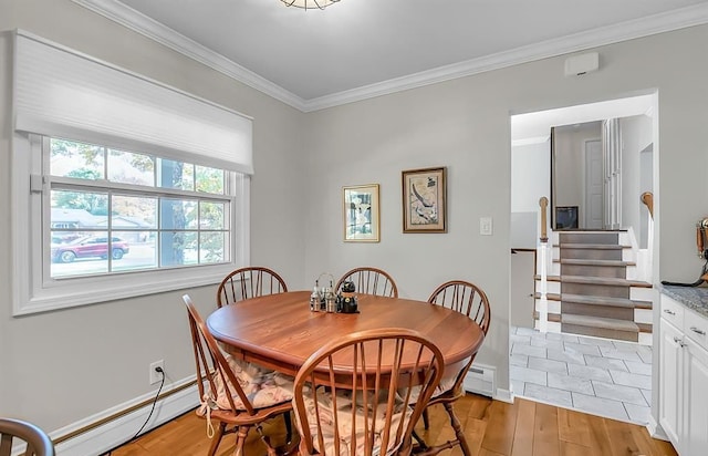 dining room with stairs, baseboard heating, crown molding, light wood-style floors, and a baseboard heating unit