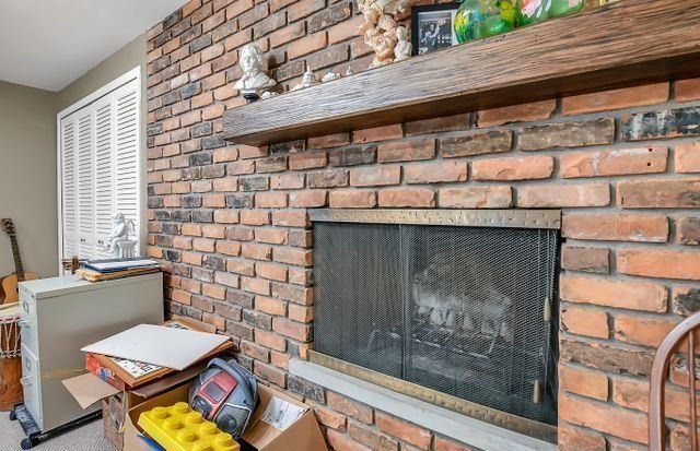 details featuring a brick fireplace