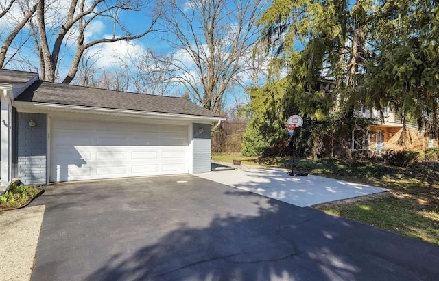 garage with aphalt driveway