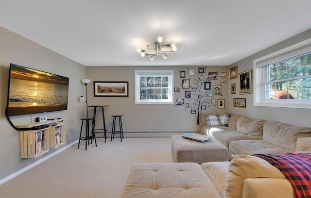 living area with baseboard heating, carpet flooring, and baseboards