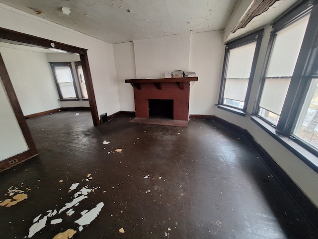 137 Elmhurst St, Highland Park, MI 48203 - unfurnished living room with a brick fireplace, baseboards, and a wealth of natural light