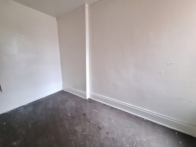137 Elmhurst St, Highland Park, MI 48203 - empty room featuring baseboards and concrete flooring