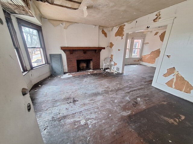137 Elmhurst St, Highland Park, MI 48203 - unfurnished living room with a brick fireplace