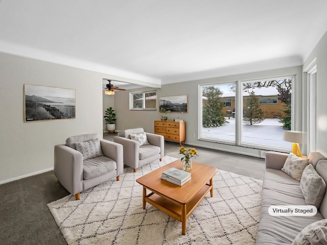 living area featuring baseboards