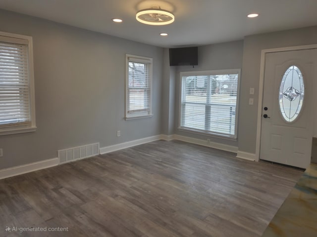 entryway with baseboards, visible vents, wood finished floors, and recessed lighting