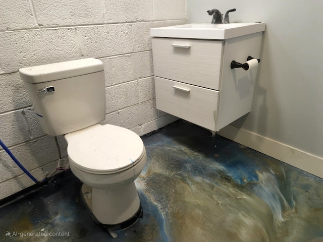 half bath featuring concrete block wall, toilet, concrete flooring, and vanity