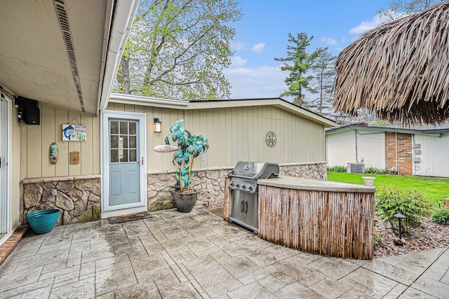 2159 Helmsford Dr, Wolverine Lake, MI 48390 - view of patio featuring area for grilling and central AC